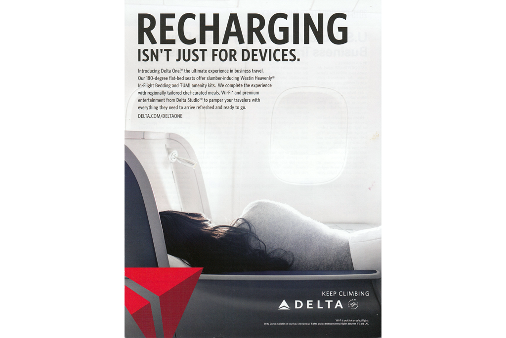 Recharging is not just for devices - woman sleeping in Business Class